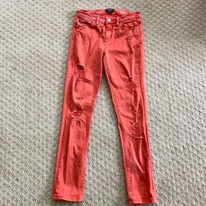 Bebe heartbreaker skinny ripped jeans